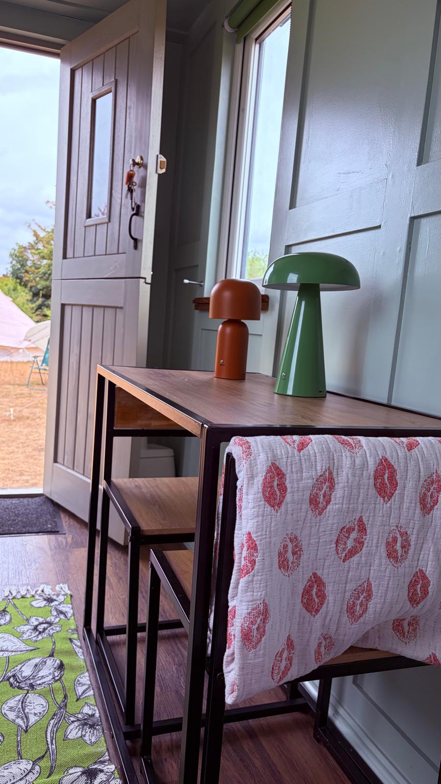 Lamps and desk in the small hut
